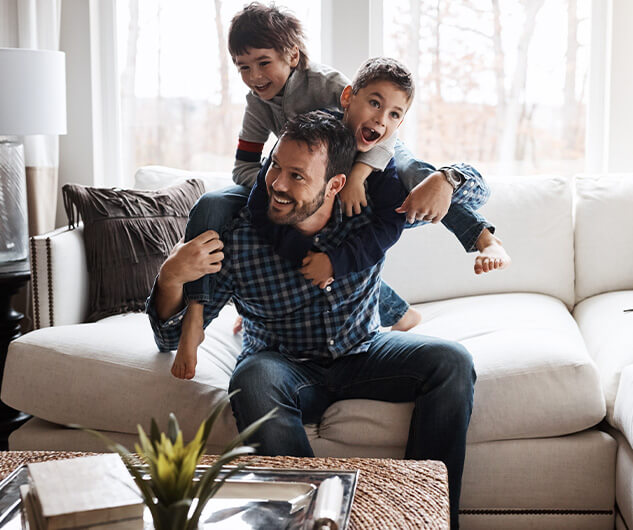 father playing with his two boys