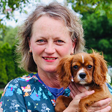 Dr. Gill holding a puppy