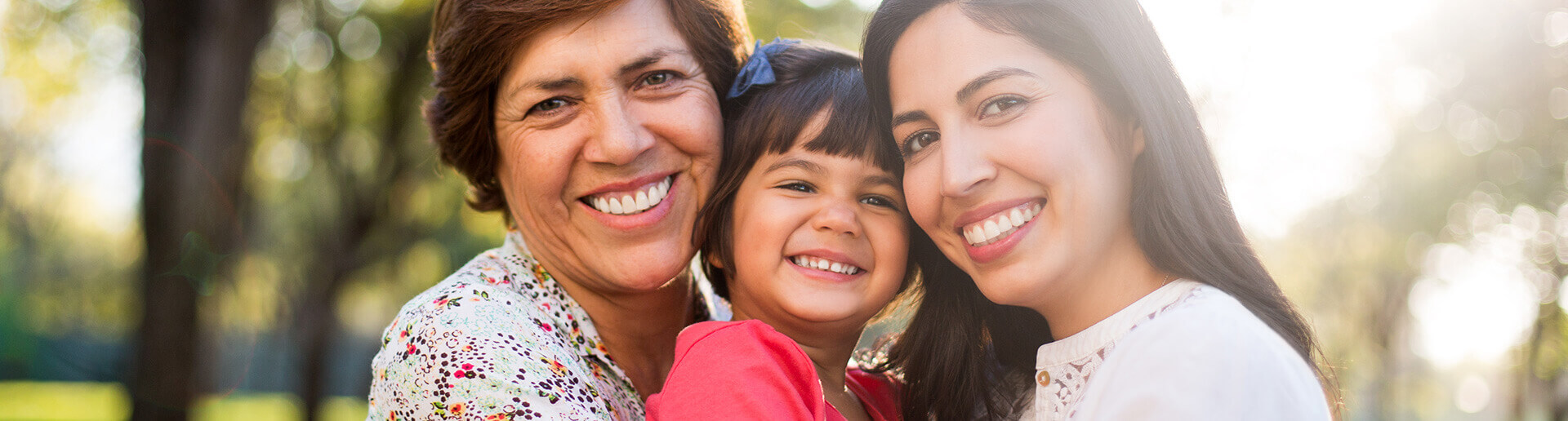 smiling mother, daughter, and grandmother